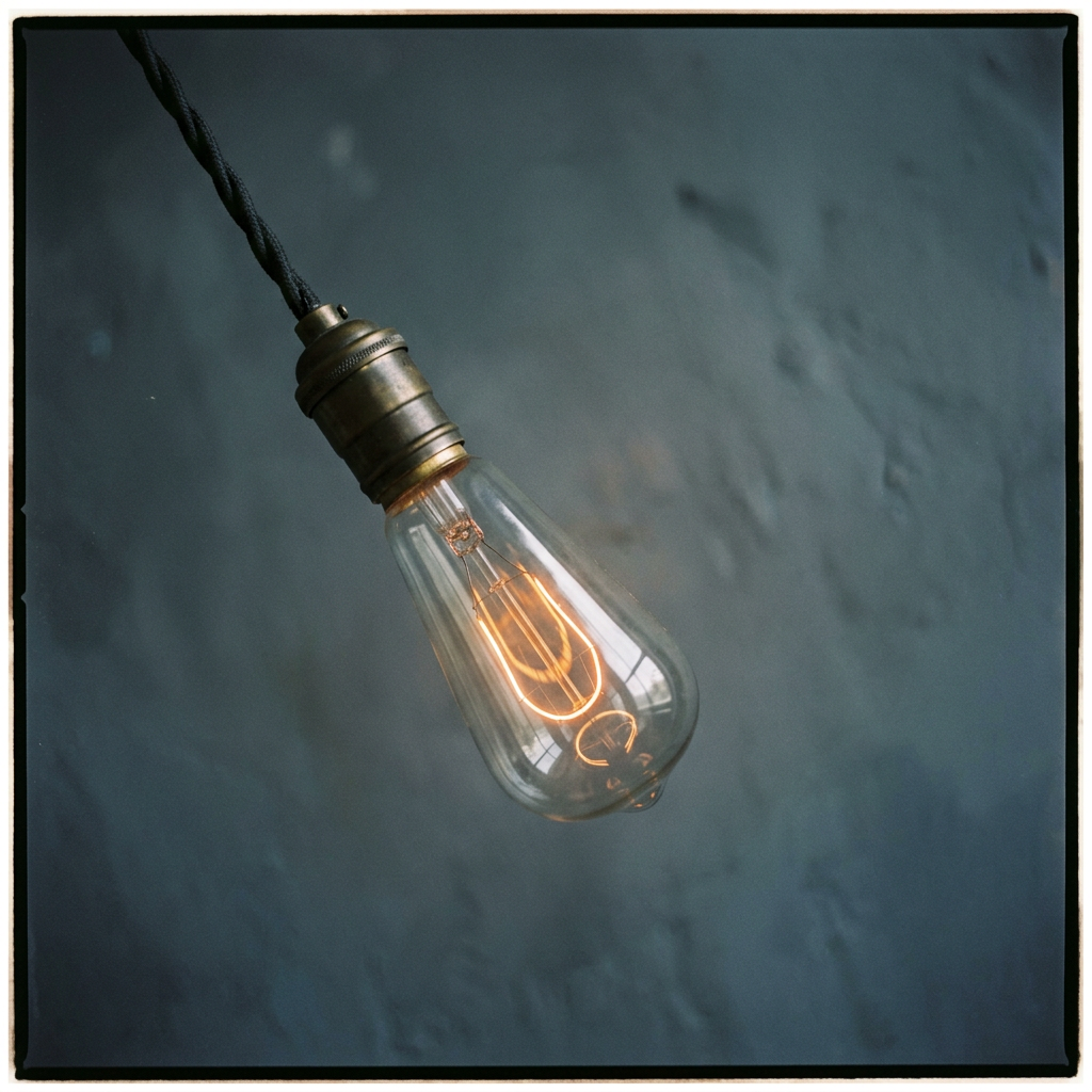 Incandescent light bulb with a glowing filament
